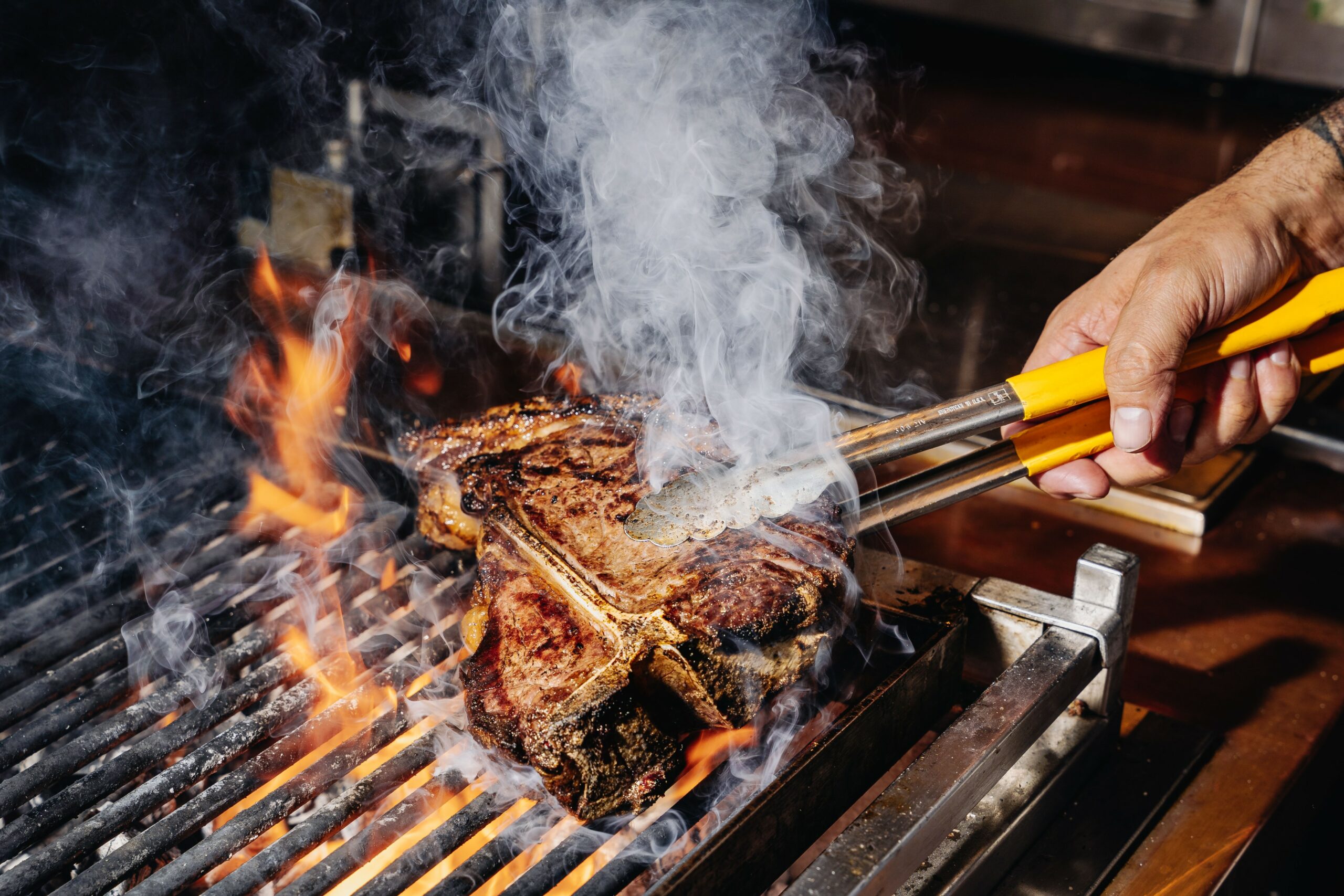 Steak on the grill over open fire