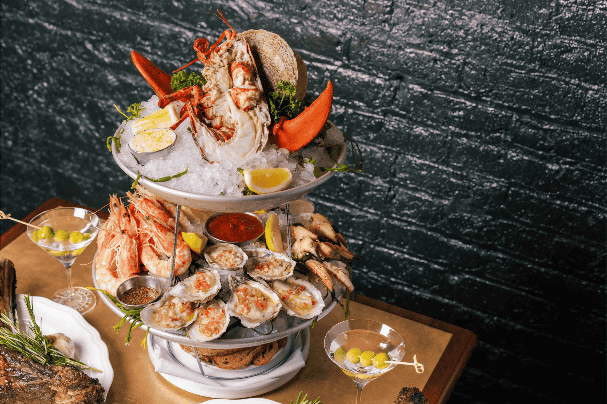 Chicago 15 A multi level platter containing various types of fresh seafood. Oysters, lobster, shrimp