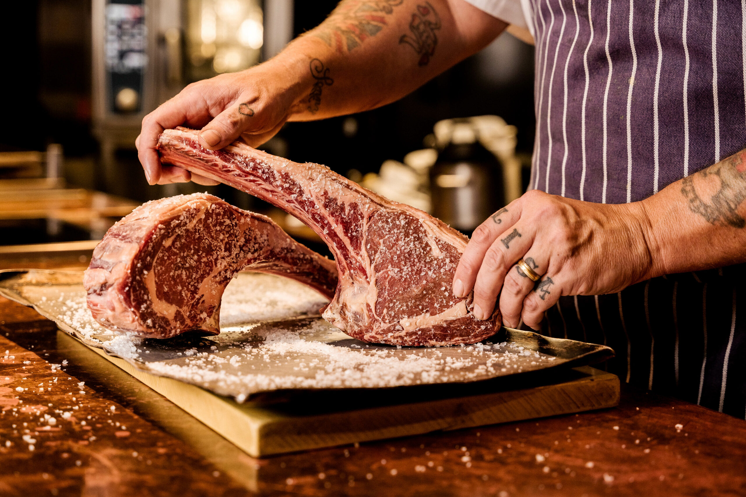 Christmas at Hawksmoor - butcher selecting a steak