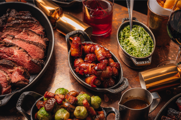 Manchester 4 Christmas feast at Hawksmoor - a table full of steaks, sideas and good vibeas