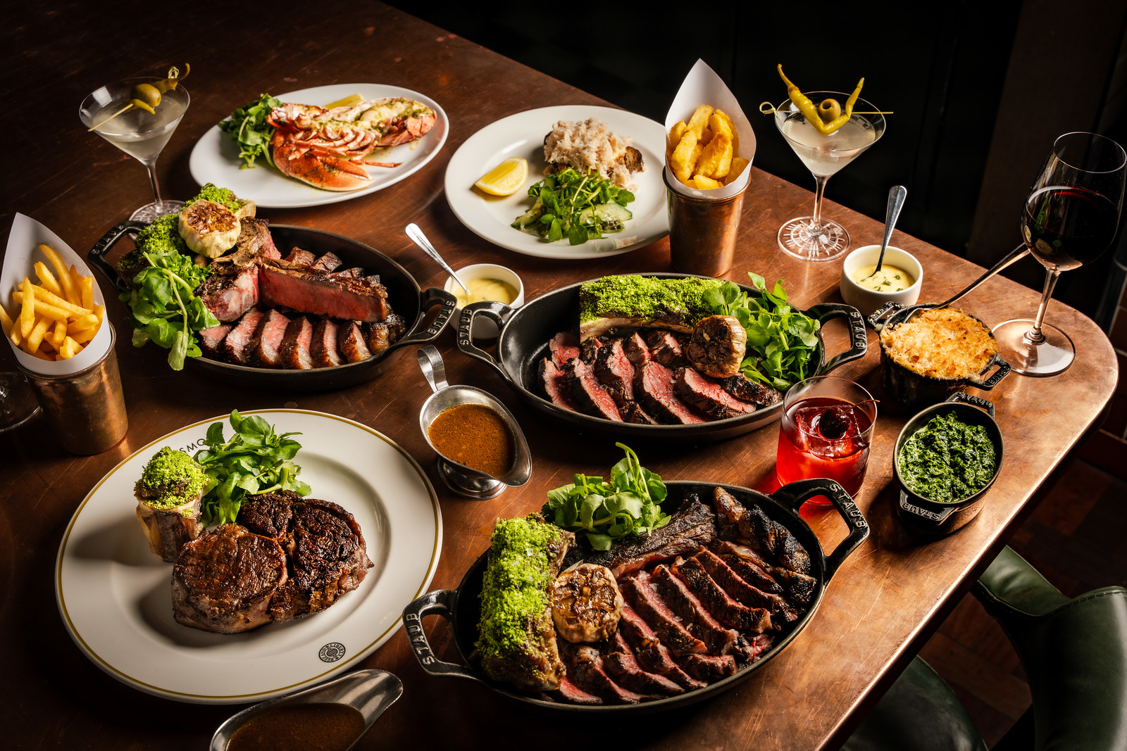A genertous table spread of Longhorn steaks, sides and starters
