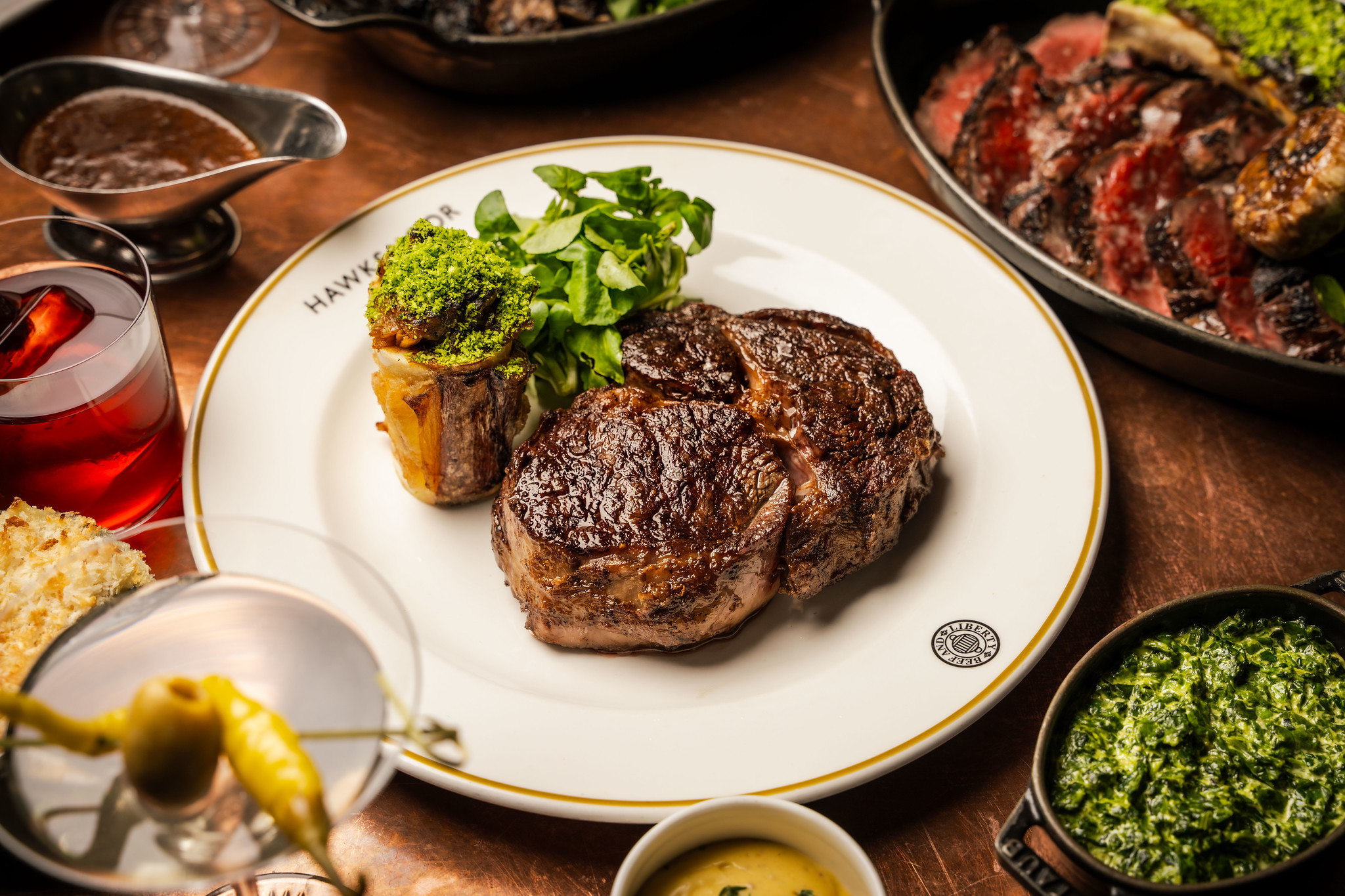 Rib-eye steak with a steakhouse salad on a white plate