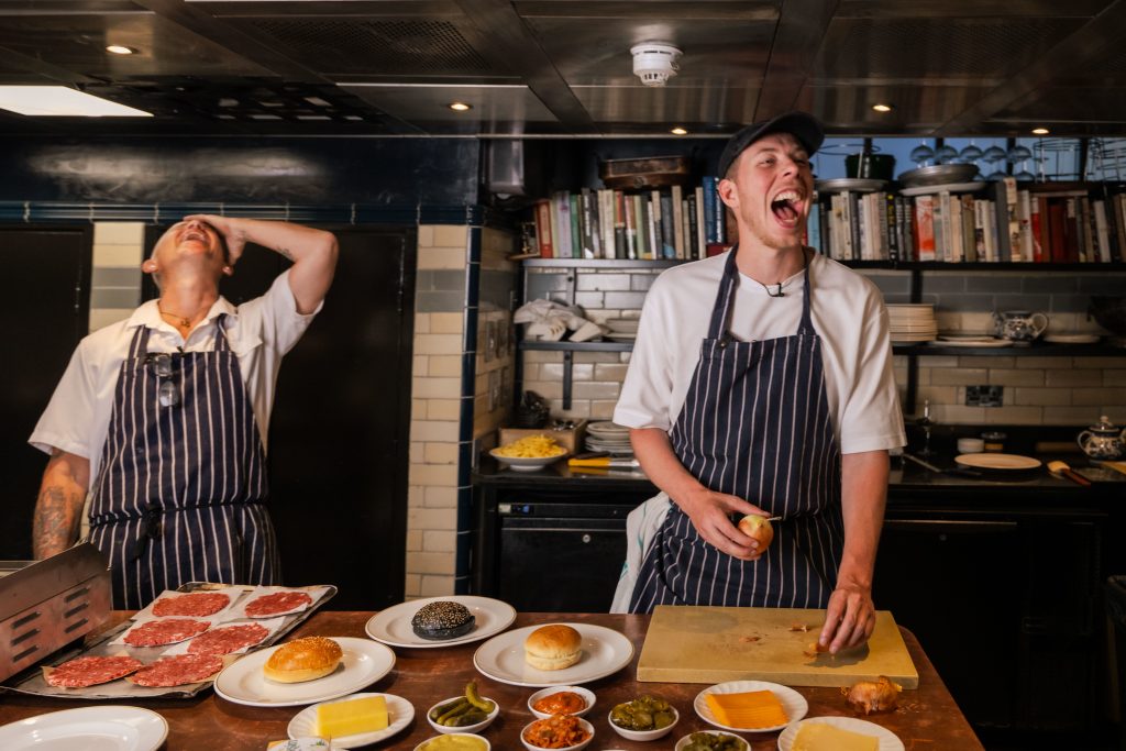 Calfreezy x Hawksmoor 2 Chef Matt and Calfrezzy laughing while working on the Burgurr build