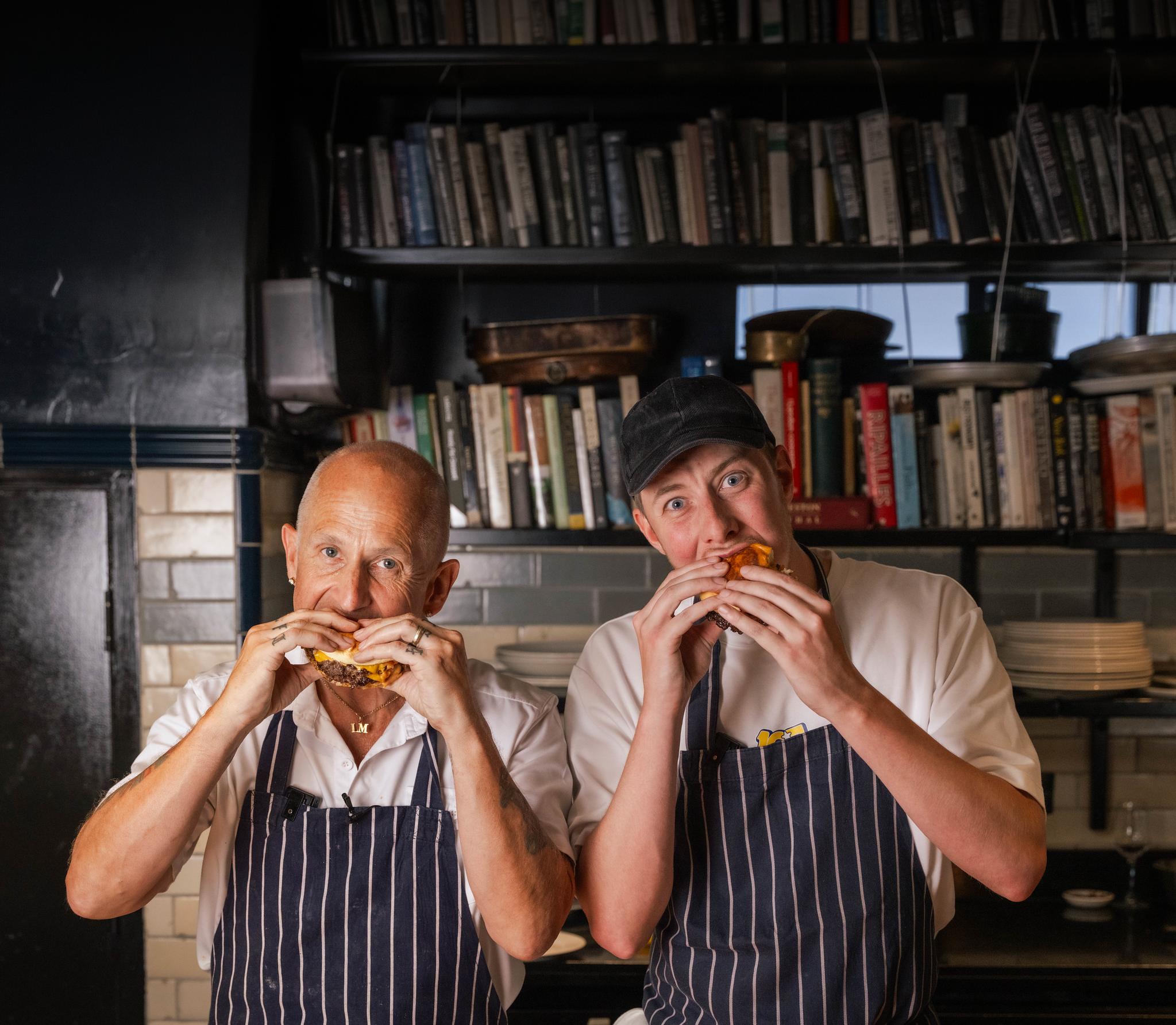 Chef Matt and Clafreezy pictured taking bites of the Burgurr