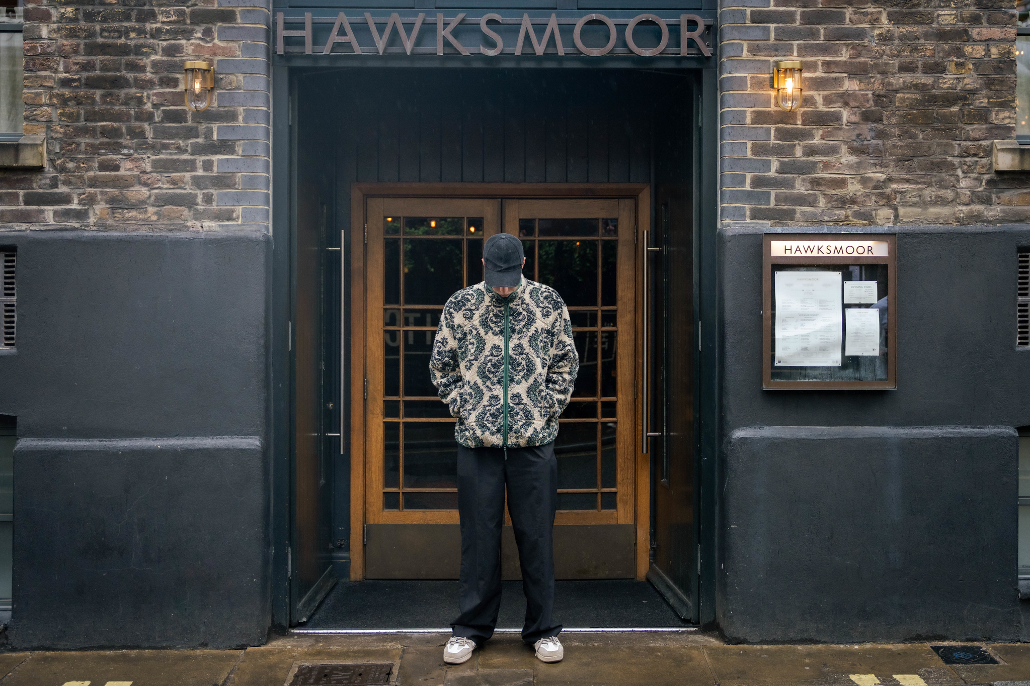 Calfreezy stoof outside Hawksmoor Spitalfields, with his head down